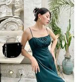 Silk midi dress with ruched bust and adjustable spaghetti straps for elegant evening wear